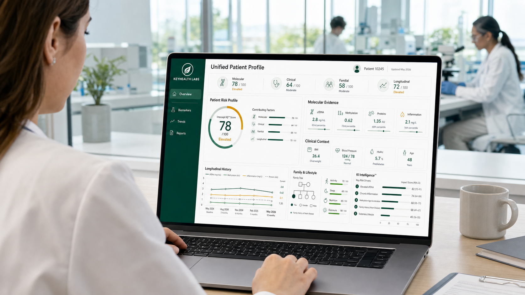 Clinician reviewing a unified patient profile dashboard on a laptop in a lab